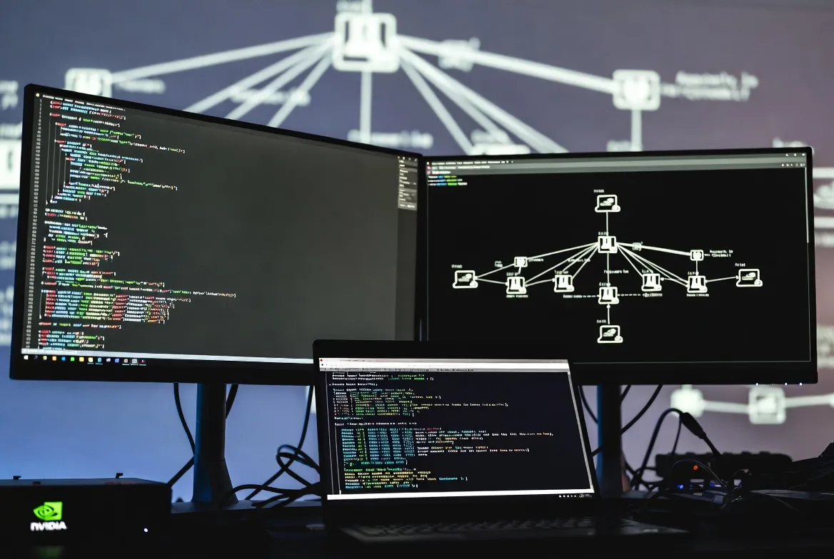 Professional cybersecurity workstation with dual monitors displaying code and network topology diagrams, NVIDIA hardware visible, focused on secure AI agent configuration